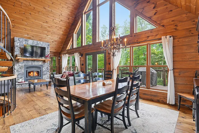 Great-room kitchen beside a stone fireplace