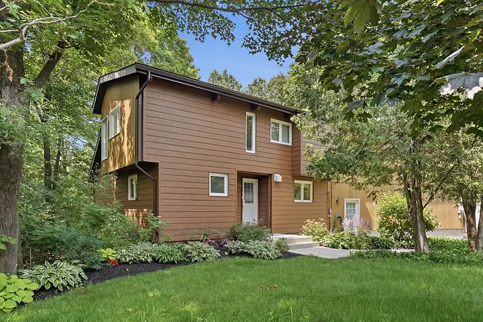 Cedar-clad home set into the trees