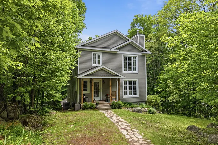 Gabled home behind a stone path